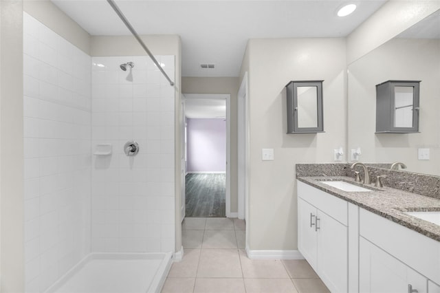 582 Royal Empress Dr, Ruskin, FL 33570 - full bathroom featuring a tile shower, double vanity, and tile patterned flooring