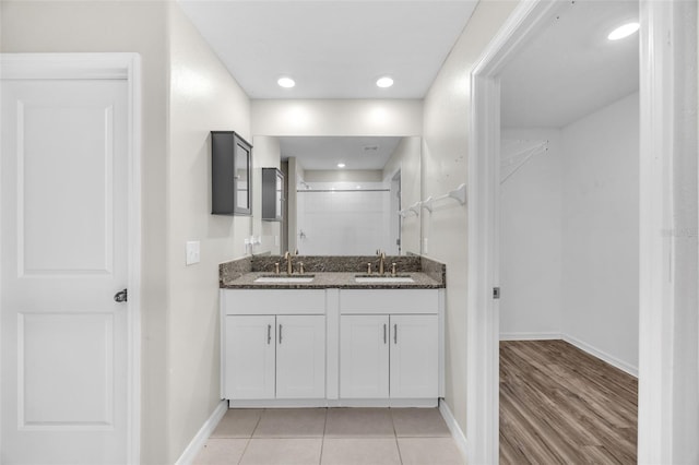582 Royal Empress Dr, Ruskin, FL 33570 - bathroom with double vanity, a shower, and recessed lighting