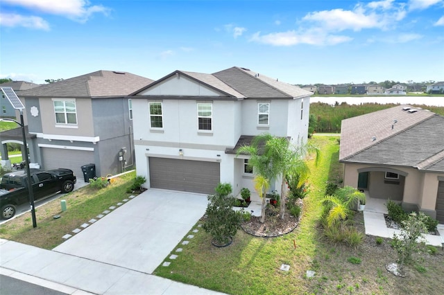 582 Royal Empress Dr, Ruskin, FL 33570 - view of front facade with stucco siding, a garage, a residential view, concrete driveway, and a shingled roof