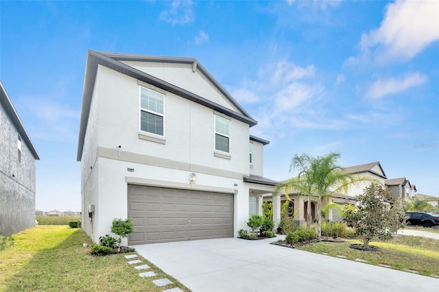 582 Royal Empress Dr, Ruskin, FL 33570 - view of front facade with stucco siding, a garage, driveway, and a front lawn
