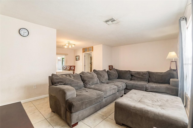 living room featuring visible vents, baseboards, and light tile patterned floors