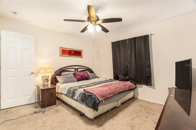 bedroom with carpet flooring, baseboards, and a ceiling fan