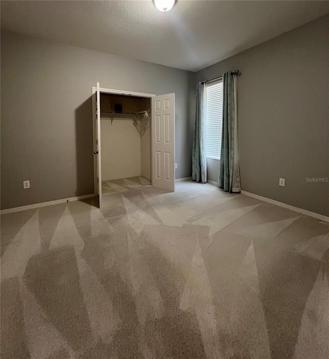 5221 Bannister Park Ln, Lithia, FL 33547 - unfurnished bedroom featuring carpet floors, baseboards, and a closet
