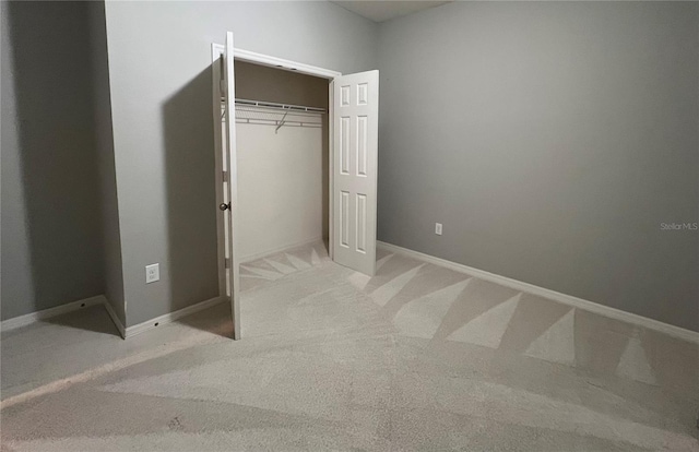 5221 Bannister Park Ln, Lithia, FL 33547 - unfurnished bedroom featuring baseboards, a closet, and light colored carpet