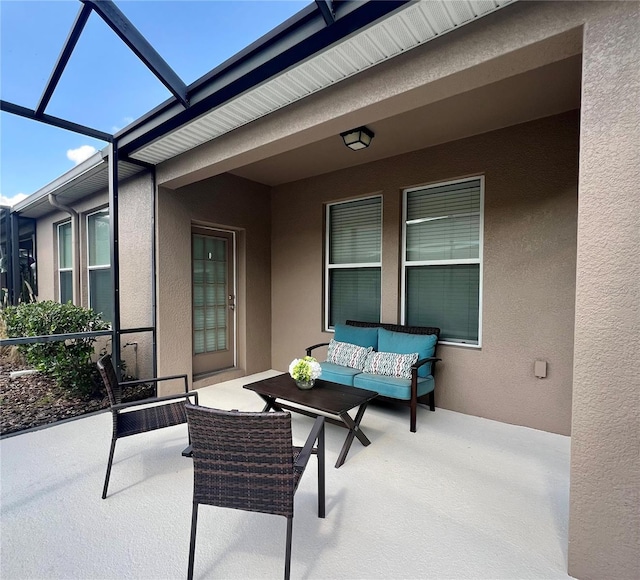 5221 Bannister Park Ln, Lithia, FL 33547 - view of patio with an outdoor living space and a lanai