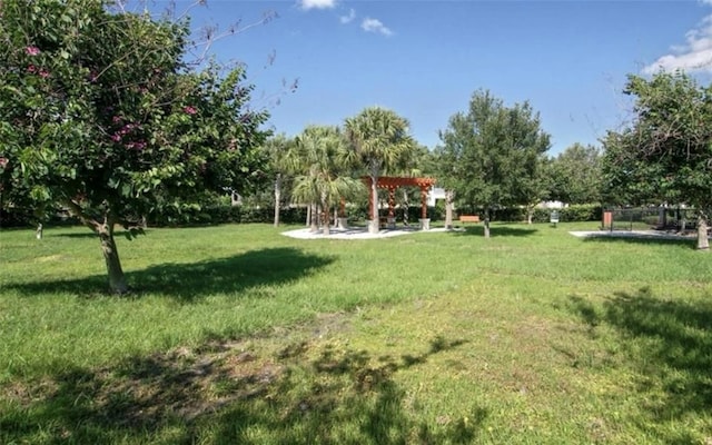 5221 Bannister Park Ln, Lithia, FL 33547 - view of yard with a pergola