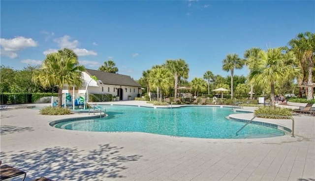 5221 Bannister Park Ln, Lithia, FL 33547 - community pool featuring a patio area