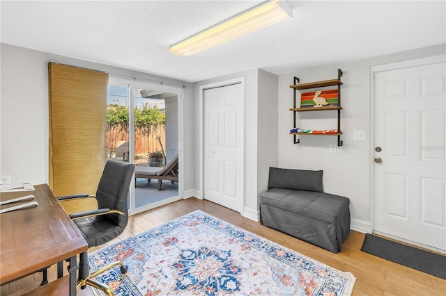 office with baseboards and wood finished floors