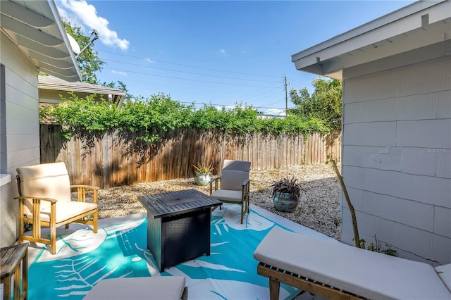 view of patio featuring fence