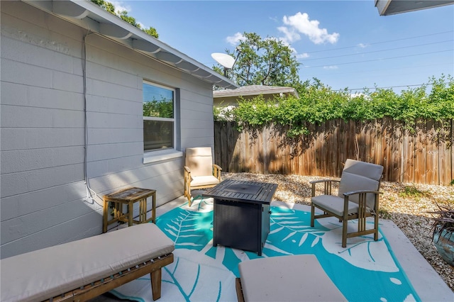 view of patio featuring fence