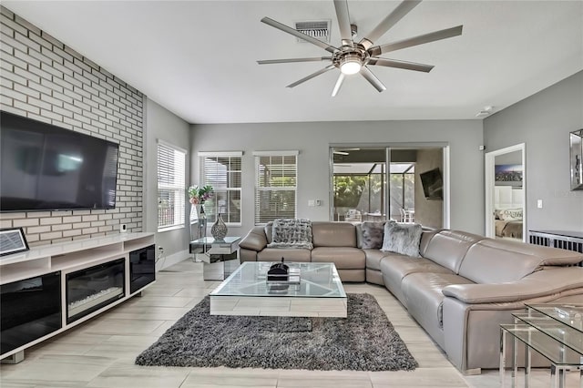 living area featuring a ceiling fan and plenty of natural light