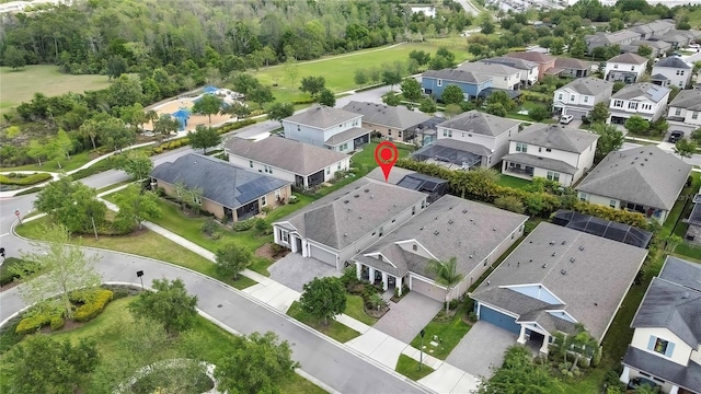 birds eye view of property with a residential view