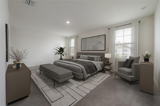 carpeted bedroom featuring recessed lighting, visible vents, and baseboards