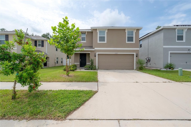 traditional home featuring a garage, stucco siding, concrete driveway, and a front lawn