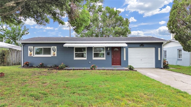 5772 4th Ave N, Saint Petersburg, FL 33710 - single story home with a front yard, an attached garage, fence, and concrete driveway