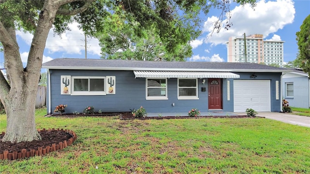 5772 4th Ave N, Saint Petersburg, FL 33710 - single story home with driveway, an attached garage, and a front lawn