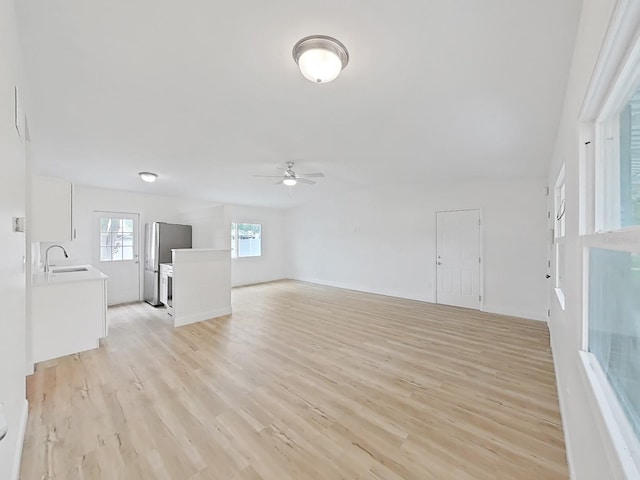 5772 4th Ave N, Saint Petersburg, FL 33710 - interior space with a sink, a ceiling fan, and light wood-style floors