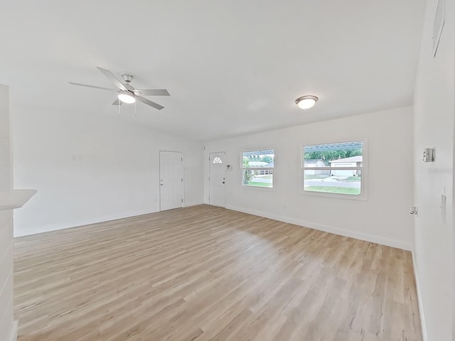 5772 4th Ave N, Saint Petersburg, FL 33710 - empty room with light wood-type flooring, baseboards, and ceiling fan