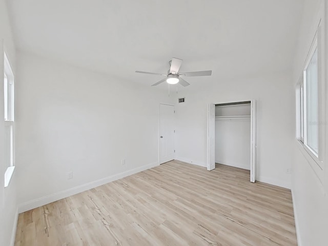 5772 4th Ave N, Saint Petersburg, FL 33710 - unfurnished bedroom with light wood finished floors, baseboards, and ceiling fan