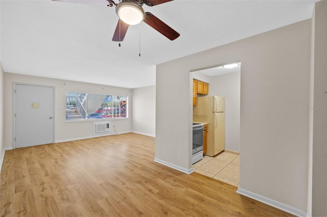 2366 Shelley St Unit 7, Clearwater, FL 33765 - unfurnished living room with a ceiling fan, baseboards, visible vents, and light wood finished floors