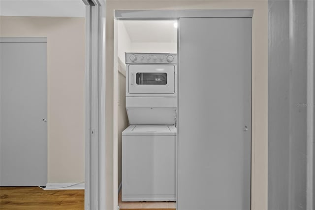 2366 Shelley St Unit 7, Clearwater, FL 33765 - laundry area featuring laundry area, stacked washer / dryer, and wood finished floors