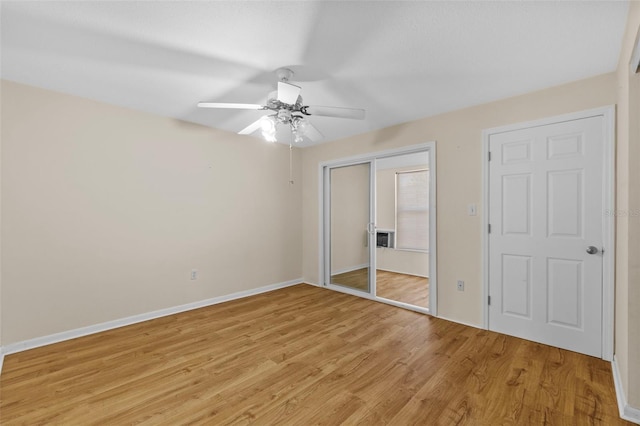 2366 Shelley St Unit 7, Clearwater, FL 33765 - unfurnished bedroom featuring light wood-style floors, a ceiling fan, baseboards, and a closet