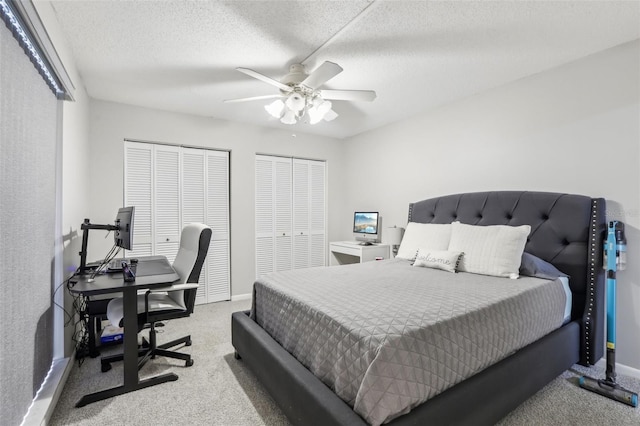 12736 Wood Trail Blvd, Tampa, FL 33625 - bedroom with a textured ceiling, carpet, multiple closets, and ceiling fan