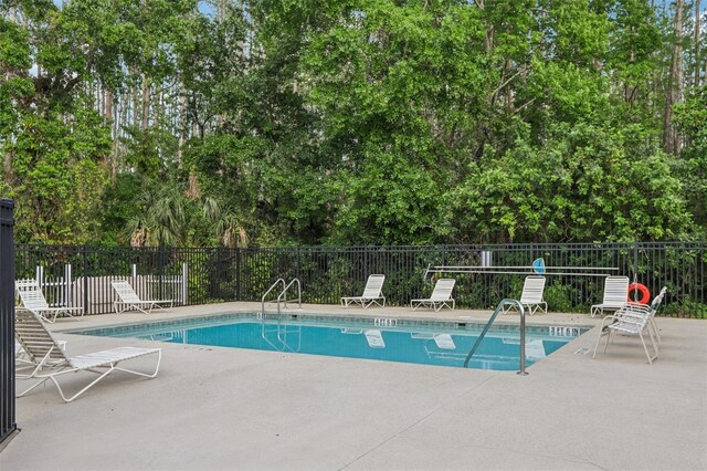 12736 Wood Trail Blvd, Tampa, FL 33625 - community pool featuring fence and a patio area