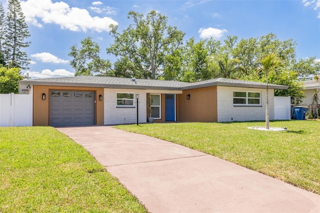 1717 Thames St, Clearwater, FL 33755 - single story home with a garage, fence, driveway, and a front lawn