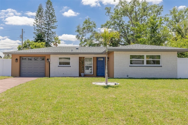 1717 Thames St, Clearwater, FL 33755 - single story home with driveway, an attached garage, a front yard, brick siding, and fence
