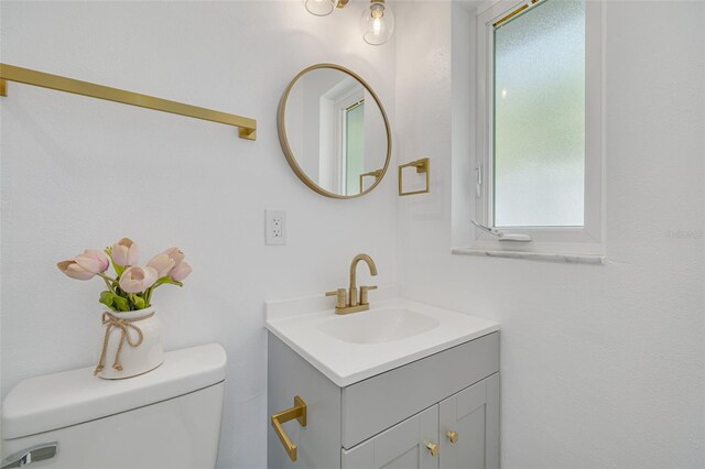 1717 Thames St, Clearwater, FL 33755 - half bathroom with vanity and toilet
