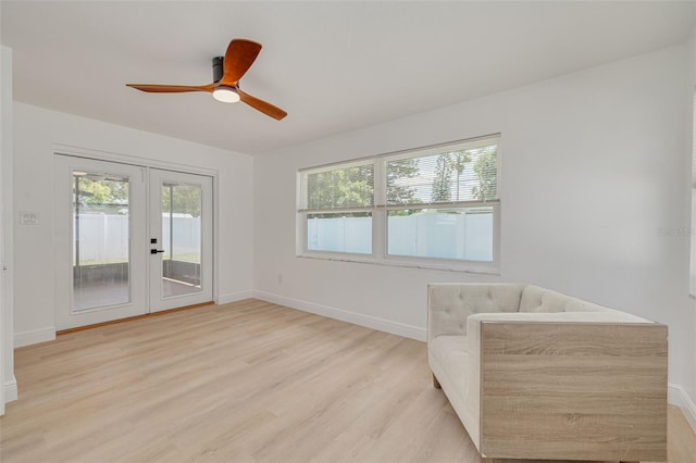 1717 Thames St, Clearwater, FL 33755 - unfurnished room featuring french doors, baseboards, a ceiling fan, and light wood-style floors
