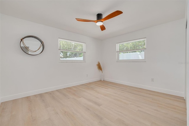 1717 Thames St, Clearwater, FL 33755 - empty room with a wealth of natural light, a ceiling fan, and baseboards