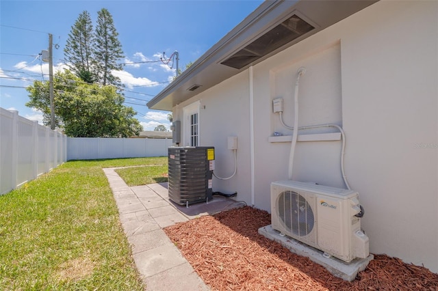 1717 Thames St, Clearwater, FL 33755 - view of yard featuring central air condition unit, ac unit, and a fenced backyard