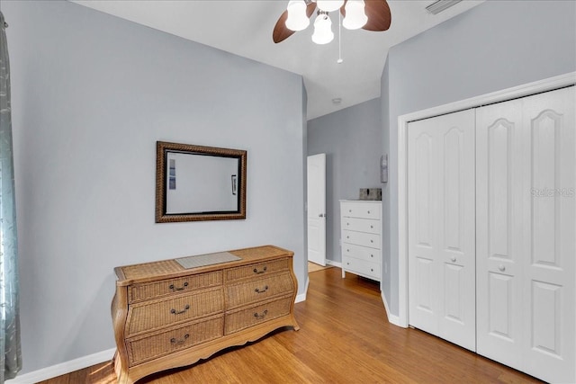8202 Pinewood Run Ct, Tampa, FL 33647 - bedroom featuring light wood finished floors, a closet, baseboards, and ceiling fan