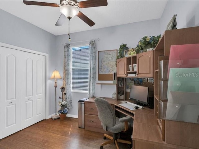 8202 Pinewood Run Ct, Tampa, FL 33647 - office space with ceiling fan, wood finished floors, and baseboards