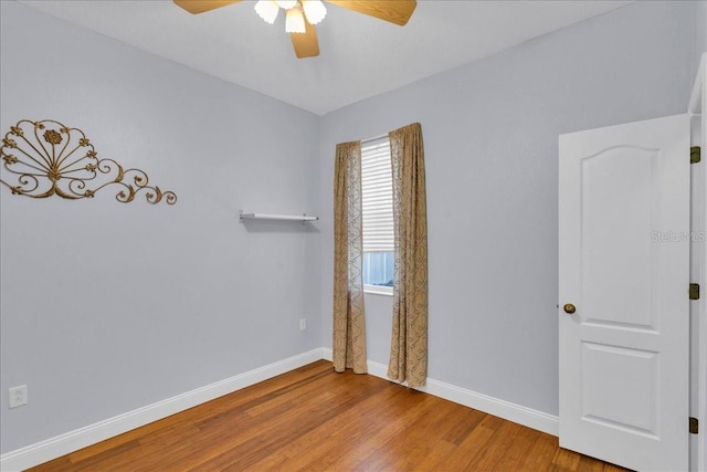 8202 Pinewood Run Ct, Tampa, FL 33647 - spare room featuring a ceiling fan, baseboards, and wood finished floors