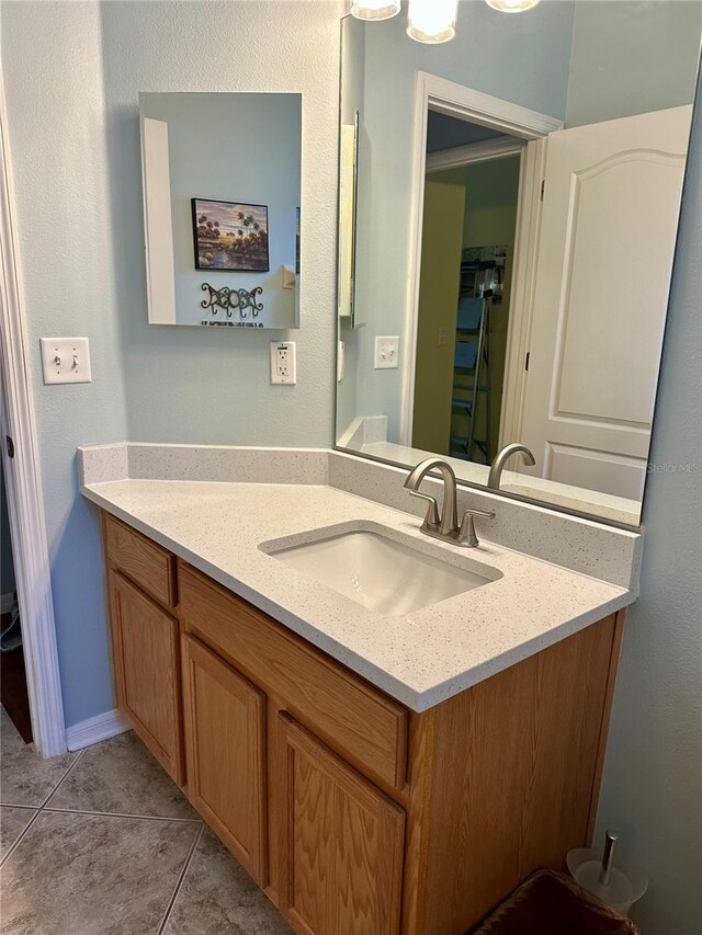 8202 Pinewood Run Ct, Tampa, FL 33647 - bathroom featuring vanity and tile patterned flooring