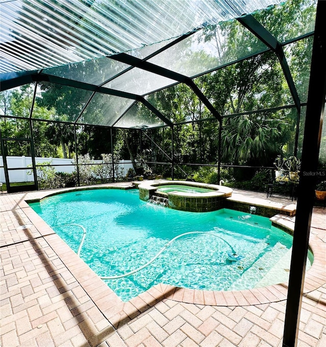 8202 Pinewood Run Ct, Tampa, FL 33647 - view of pool featuring a pool with connected hot tub, a patio, and glass enclosure