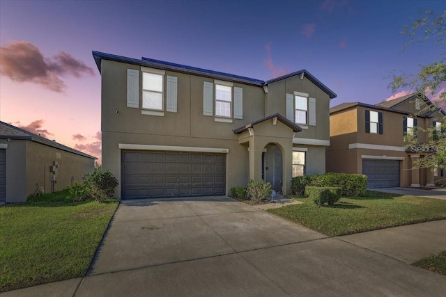 11476 Sage Canyon Dr, Riverview, FL 33578 - view of front of property with concrete driveway, stucco siding, an attached garage, and a lawn
