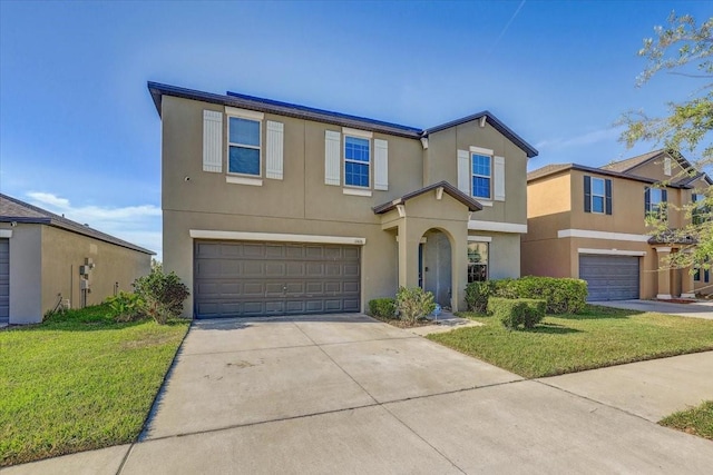 11476 Sage Canyon Dr, Riverview, FL 33578 - view of front of house featuring driveway, a front lawn, a garage, and stucco siding