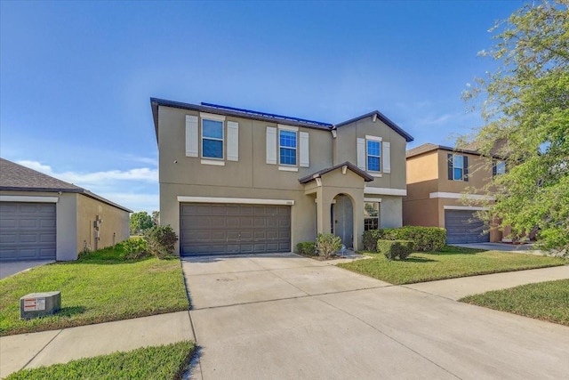 11476 Sage Canyon Dr, Riverview, FL 33578 - traditional-style house featuring a front yard, concrete driveway, a garage, and stucco siding