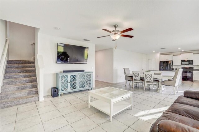 11476 Sage Canyon Dr, Riverview, FL 33578 - living room featuring light tile patterned floors, visible vents, a ceiling fan, recessed lighting, and stairway