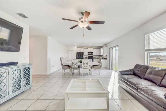 11476 Sage Canyon Dr, Riverview, FL 33578 - living area featuring visible vents, ceiling fan, and light tile patterned floors