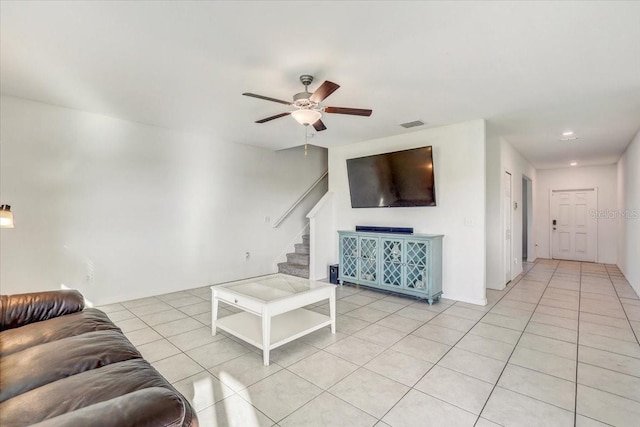 11476 Sage Canyon Dr, Riverview, FL 33578 - living area featuring visible vents, a ceiling fan, light tile patterned flooring, and stairs