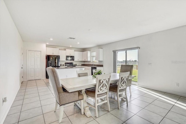 11476 Sage Canyon Dr, Riverview, FL 33578 - dining space with light tile patterned flooring, baseboards, visible vents, and recessed lighting