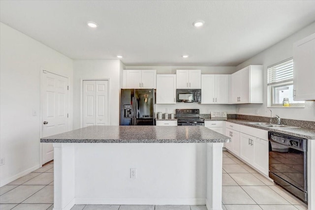 11476 Sage Canyon Dr, Riverview, FL 33578 - kitchen with a sink, white cabinetry, black appliances, and a kitchen island