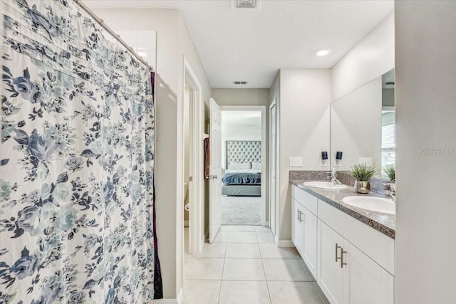 11476 Sage Canyon Dr, Riverview, FL 33578 - full bathroom with a sink, ensuite bathroom, tile patterned floors, and double vanity
