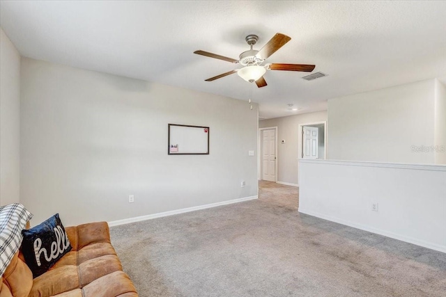 11476 Sage Canyon Dr, Riverview, FL 33578 - living room with visible vents, baseboards, a ceiling fan, and carpet floors