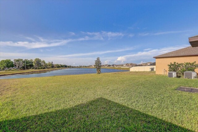 11476 Sage Canyon Dr, Riverview, FL 33578 - view of yard featuring central AC and a water view